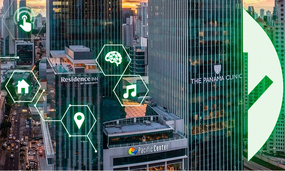 Edificios futuristas con hexágonos verdes e íconos digitales que representan conexión, inteligencia y tecnología moderna