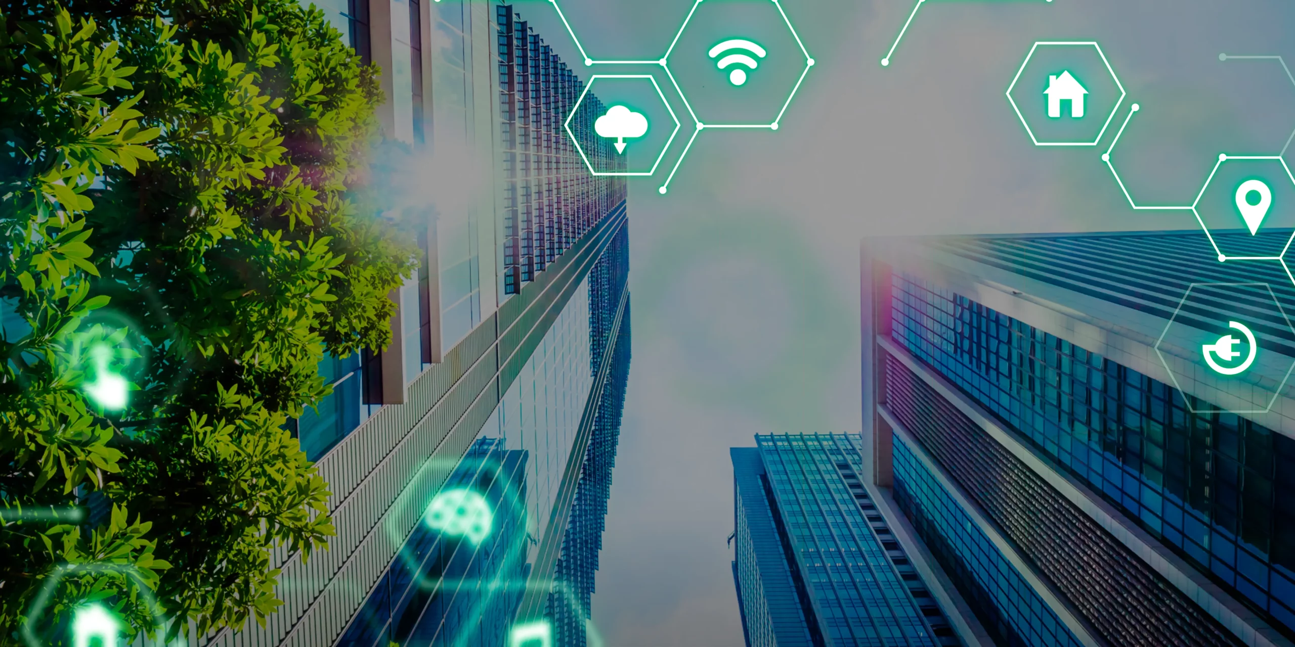 Dos edificios con árboles y hexágonos verdes iluminados representando automatización de procesos y conexión.